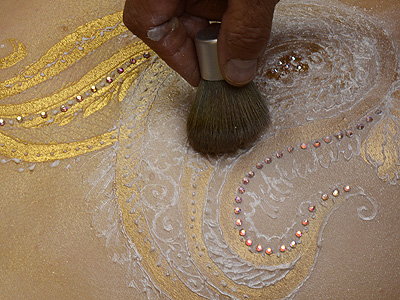 brush excess powder away from 'white henna' paste